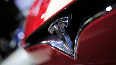 Tesla is sticking to its targets on new Model 3 but says spending may increase further. Christophe Ena/AP