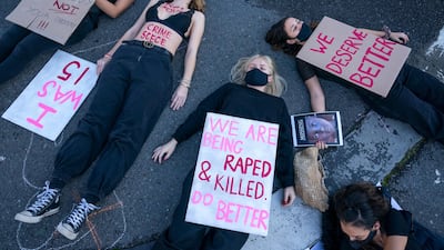 NO 131 SOUTH AFRICA: Women protest against gender violence outside parliament in Cape Town on June 30, 2020. Crimes such as carjacking, ATM robbery, home invasion and rape remain very high, making the country among the most dangerous in the world. Nic Bothma / EPA