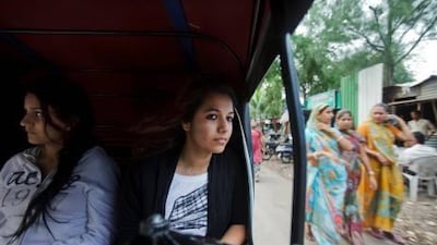 Sanah Chauhan, centre, and her friend Navsheen Kaul are first year students at Symbiosis Institute of Media and Communication in Pune, India, rhaving travelled from the UAE a month ago.