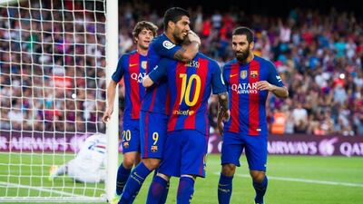 Luis Suarez (2nd L) of Barcelona celebrates with his teammate Lionel Messi (2nd R) next to their teammates Sergi Roberto (L) and Arda Turan (R) after scoring the opening goal during the Joan Gamper Trophy match between FC Barcelona and UC Sampdoria at Camp Nou on August 10, 2016 in Barcelona, Spain. Alex Caparros / Getty Images