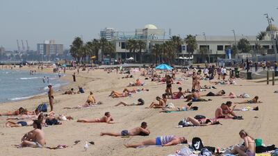 People flock to St Kilda beach as a heatwave sweeps across the state of Victoria, in St Kilda, south of Melbourne. EPA