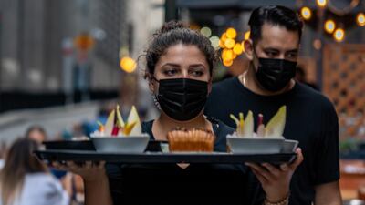 If staff can wear face masks all day, customers should remember to do so when they need to leave the table, even temporarily. Photo: David 'Dee' Delgado / Bloomberg
