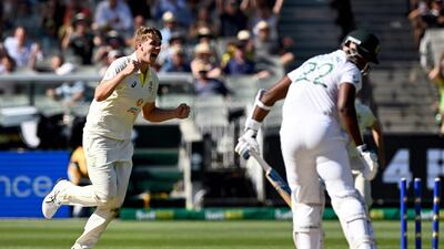 Australia's Cameron Green (L) celebrates dismissing South African batsman Lungi Ngidi (R) on the first day of the second cricket Test match between Australia and South Africa at the MCG in Melbourne on December 26, 2022. (Photo by William WEST / AFP) / -- IMAGE RESTRICTED TO EDITORIAL USE - STRICTLY NO COMMERCIAL USE --