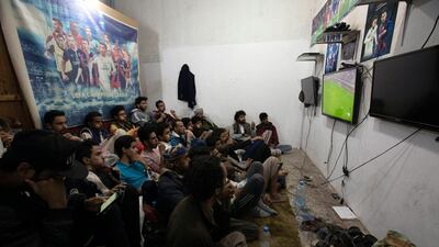 Soccer supporters of Yemen watch a television broadcast of the 24th Arabian Gulf Cup Group B football match between Yemen and the United Arab Emirates, inside a shop in Sana'a, Yemen EPA