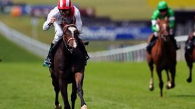 Ridden by Neil Callan, Misheer strides to victory in the Cherry Hinton Stakes at Newmarket yesterday.