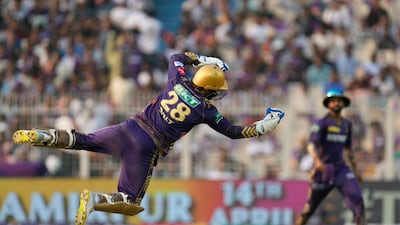 Kolkata Knight Riders' Phil Salt dives to catch Lucknow Super Giants' Marcus Stoinis out. AP