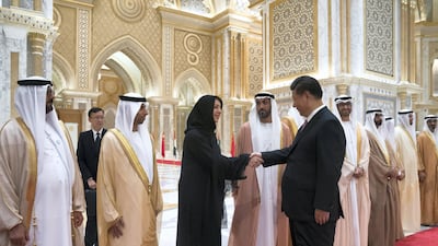 Xi Jinping greets Reem Al Hashimi at the Presidential Palace. Crown Prince Court - Abu Dhabi