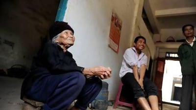 Xu Yuhe, 104, during a family chat at her house in Chengmai city, in China's southern Hainan province.