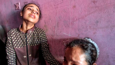 Relatives of Mohammed Al-Houm, 14, who was killed during a protest along the Israel-Gaza border fence, mourn at his funeral in Gaza. AFP