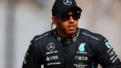 ABU DHABI, UNITED ARAB EMIRATES - NOVEMBER 20: Lewis Hamilton of Great Britain and Mercedes looks on ahead of the F1 2022 End of Year photo prior to the F1 Grand Prix of Abu Dhabi at Yas Marina Circuit on November 20, 2022 in Abu Dhabi, United Arab Emirates. (Photo by Mark Thompson / Getty Images)
