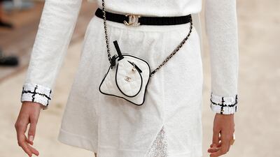 In keeping with the carefree cruise collection philosophy, a bag is decorated with a tiny tennis racquet. Photo: EPA