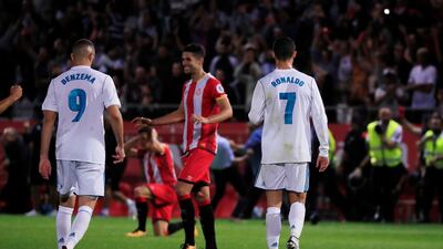 Real Madrid’s Cristiano Ronaldo, right, and Karim Benzema look dejected after the 2-1 defeat to Girona. Juan Medina / Reuters