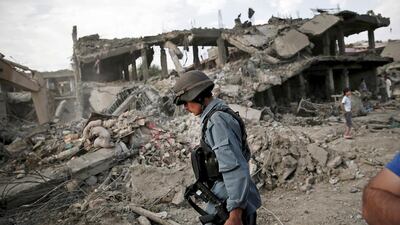 An Afghan policeman is pictured at the site of a truck bomb blast in Kabul on August 7, 2015. Ahmad Masood/Reuters