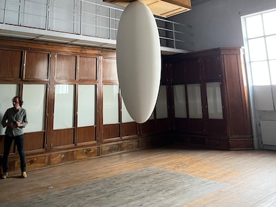 Palestinian-Swedish artist Tarik Kiswanson asked what it would be like to stand underneath the past. He drilled the Musee Guimet galleries' vitrines and desks into the ceiling, placing futuristic egg-like sculptures beneath them. Melissa Gronlund / The National
