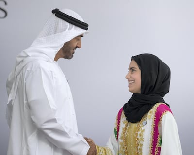 Sheikh Mohammed bin Zayed, Crown Prince of Abu Dhabi and Deputy Supreme Commander of the UAE Armed Forces, presents an Abu Dhabi Award to Fatima Al Kaabi. Ryan Carter for the Crown Prince Court - Abu Dhabi