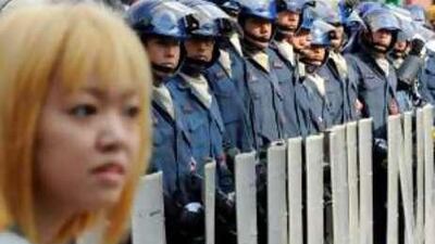 Japanese riot police stand guard ahead of the G8 summit.