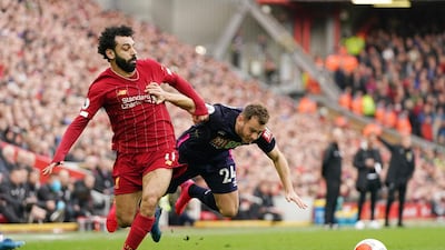 Liverpool's Mohamed Salah, left, challenges for the ball with Bournemouth's Ryan Fraser on Saturday. AP
