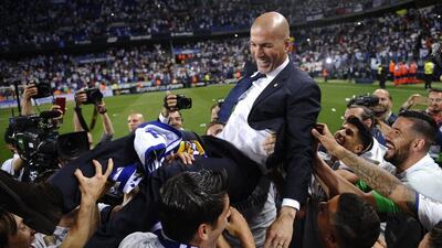 Zinedine Zidane is thrown into the air by his Real Madrid players after defeating Malaga 2-0 to clinch the Primera Liga title on Sunday, May 21, 2017. Daniel Tejedor / AP Photo