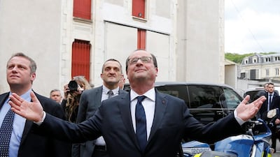 French president Francois Hollande waves as he leaves a restaurant in Tulle — a town in his electoral district of Correze — on May 7, 2017, during the second round of the presidential election. Regis Duvignau / Reuters