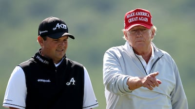 Mr Trump talks with golfer Patrick Reed during the pro-am prior to the LIV Golf Invitational. AFP