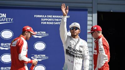 Lewis Hamilton, centre, has Kimi Raikkonen, left, beside him and Sebastian Vettel right behind for Sunday’s start at the Italian Grand Prix in Monza. The Mercedes-GP driver will do his best to keep them behind him at the start, which may will determine the finish. Olivier Morin / AFP
