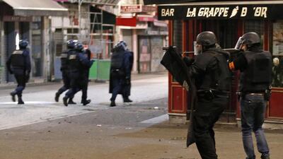 Police forces operate in Saint-Denis, a northern suburb of Paris on Wednesday. Authorities in the Paris suburb of Saint-Denis are telling residents to stay inside during a large police operation near France’s national stadium that two officials say is linked to last week’s deadly attacks. Francois Mori / AP