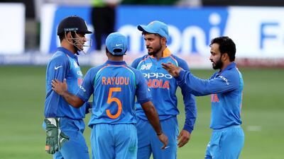 DUBAI , UNITED ARAB EMIRATES, September 19 , 2018 :- Kedar Jadhav ( right ) of India celebrating after taking the wicket of Asif Ali during the Asia Cup UAE 2018 cricket match between Pakistan vs India held at Dubai International Cricket Stadium in Dubai. ( Pawan Singh / The National ) For Sports. Story by Paul