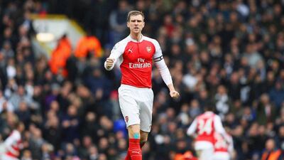 Per Mertesacker of Arsenal celebrates a goal during his team's draw against Tottenham in the Premier League on Saturday. Paul Gilham / Getty Images / March 5, 2016