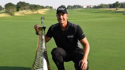 Henrik Stenson of Sweden poses with the Race to Dubai trophy during day four of the DP World Tour Championship at Jumeirah Golf Estates on November 20, 2016 in Dubai, United Arab Emirates. Ross Kinnaird / Getty Images