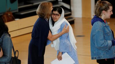 Malala Yousefzai is congratulated after collecting her 'A-Level exam results at Edgbaston High School for Girls in Birmingham. Darren Staples / Reuters