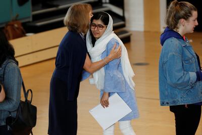 Malala Yousefzai is congratulated after collecting her 'A-Level exam results at Edgbaston High School for Girls in Birmingham. Darren Staples / Reuters