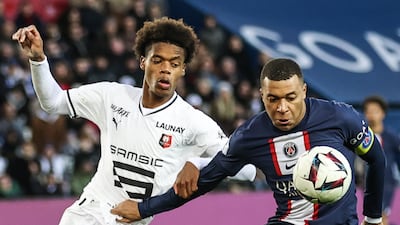 Paris Saint-Germain's Kylian Mbappe and Warmed Omari of Rennes in action. EPA