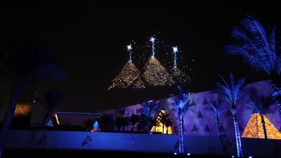 Lightning effects depicting one of the ancient symbols formed by drones illuminate the sky above the Grand Egyptian Museum during the opening ceremony in Giza on November 1. Getty Images