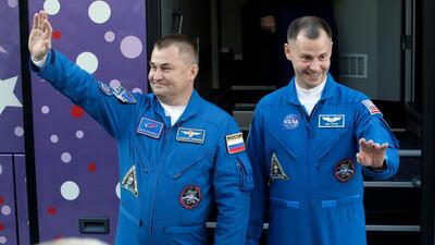 US astronaut Nick Hague, right, and Russian cosmonaut Alexey Ovchinin, wave to their relatives prior to launch. AP Photo