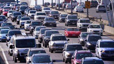 Bumper-to-bumper northbound traffic rolls across the Zakim Bridge into Boston. Bridge improvement makes up part of the new infrastructure bill. AP