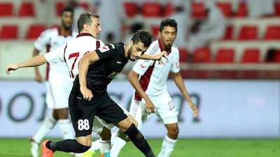 Al Wahda, in white, came away with a draw against Al Ahli on Friday night. Afsal Sham / Al Ittihad