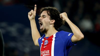 PSG's Vitinha celebrates making it 3-2 against Barcelona. EPA