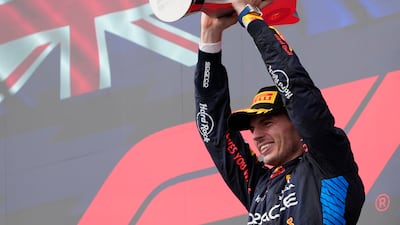 Red Bull's Max Verstappen celebrates on the podium after winning the Emilia Romagna Grand Prix at Imola, Italy, on Sunday, May 19, 2024. AP