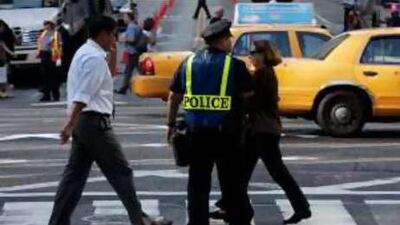 A New York City police officer stands watch near the United Nations building in New York.