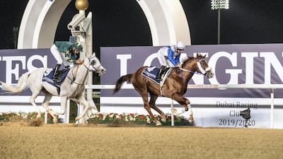 Jockey Sam Hitchcott guides Es Ajeeb to victory at Meydan Racecourse on Thursday night. Antonie Robertson / The National