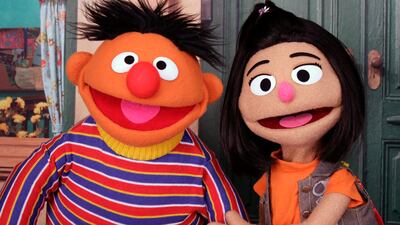 Ernie from 'Sesame Street' appears with new character Ji-Young, the first Asian-American muppet, on the set of the long-running children's programme. AP