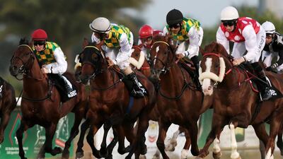 Patrick Cosgrave atop Musharab, left, rides to victory during the Emirates Championship race at the Abu Dhabi Equestrian Club on March 16, 2014. Christopher Pike / The National