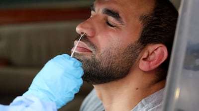 The new screening drive through for COVID-19, Zayed Sports City, Abu Dhabi. Chris Whiteoak / The National