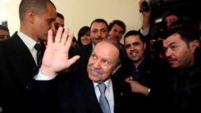 Abdelaziz Bouteflika waves to supporters after sweeping to an election victory with just over 90 per cent of the vote.