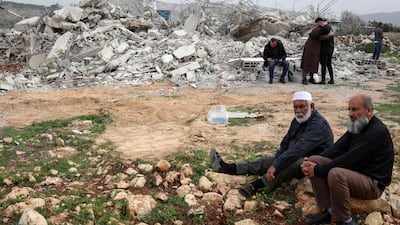 Palestinians gather by the rubble of a home demolished by the Israeli army in the village of Shuqba, in the occupied West Bank. AFP