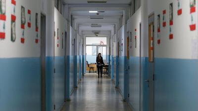 A teacher walks along a corridor of a public school in Beirut, Lebanon December 12, 2019. Reuters