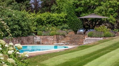 The heated swimming pool in the garden