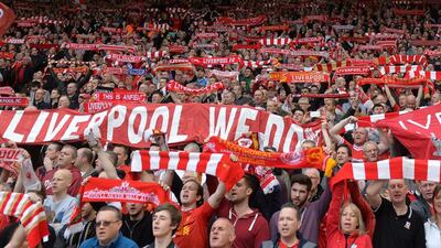 Liverpool fans hold up scarves in the crowd during the English Premier League football match between Liverpool and Tottenham Hotspur at Anfield in Liverpool, on Sunday. Paul Ellis / AFP / March 30, 2014