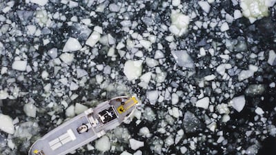 A boat making its way through the icy water of Lidingo, near Stockholm, Sweden. AFP