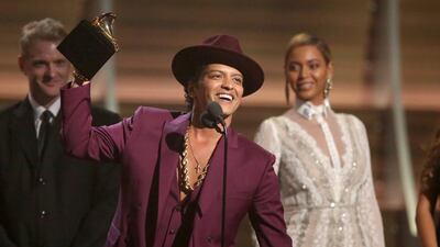 Bruno Mars accept the award for record of the year for Uptown Funk at the 58th annual Grammy Awards. Matt Sayles / Invision / AP